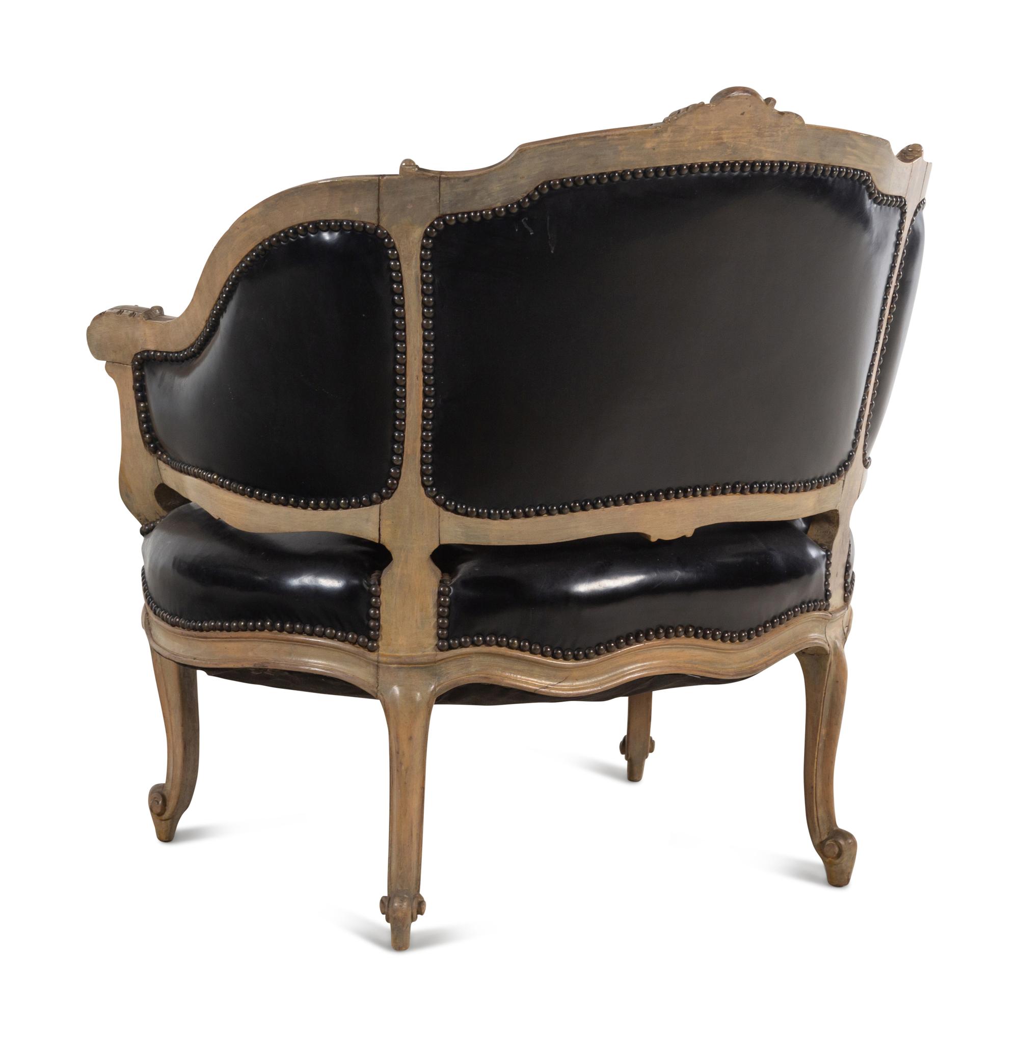A Louis XV Style Painted and Black Leather Upholstered Bergère