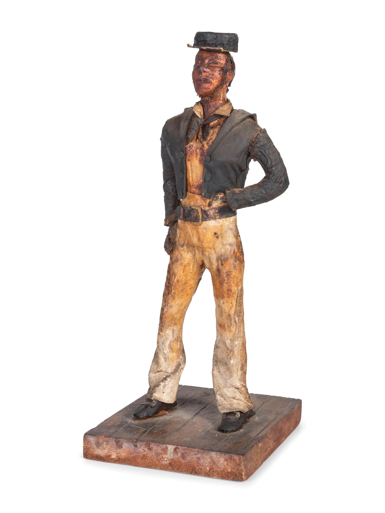 A Carved Wood and Papier-Mache Figure of a Sailor