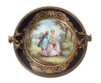 A French Gilt Bronze Mounted Sevres Porcelain Plate Diameter 10 1/4 inches.