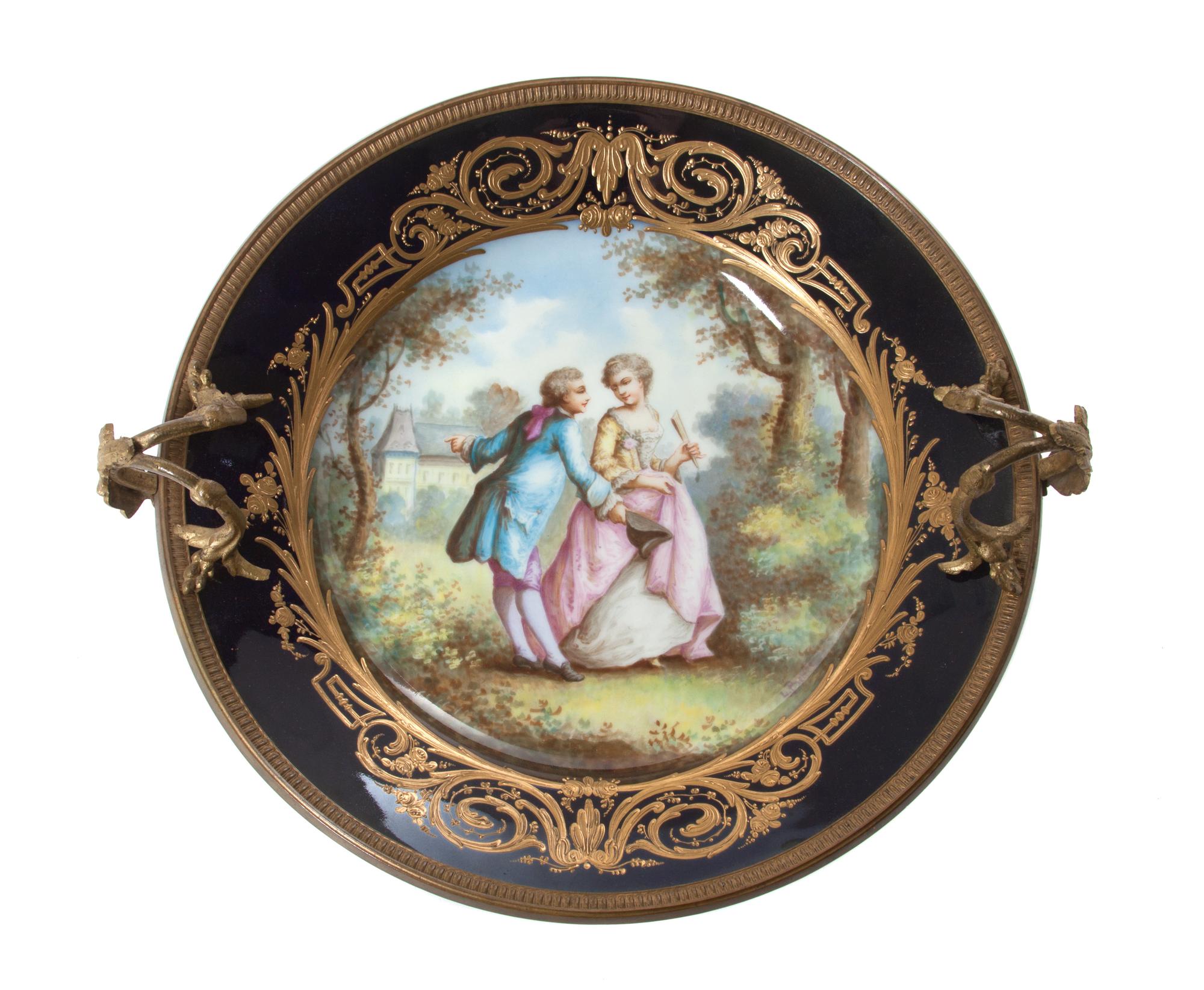 A French Gilt Bronze Mounted Sevres Porcelain Plate Diameter 10 1/4 inches.