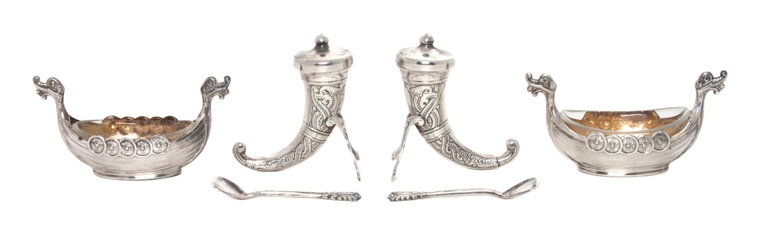 Two Norwegian Silver Salt Sets, Magnus Aaes for David Andersen, each set comprising a boat form salt cellar with a glass liner, a spoon