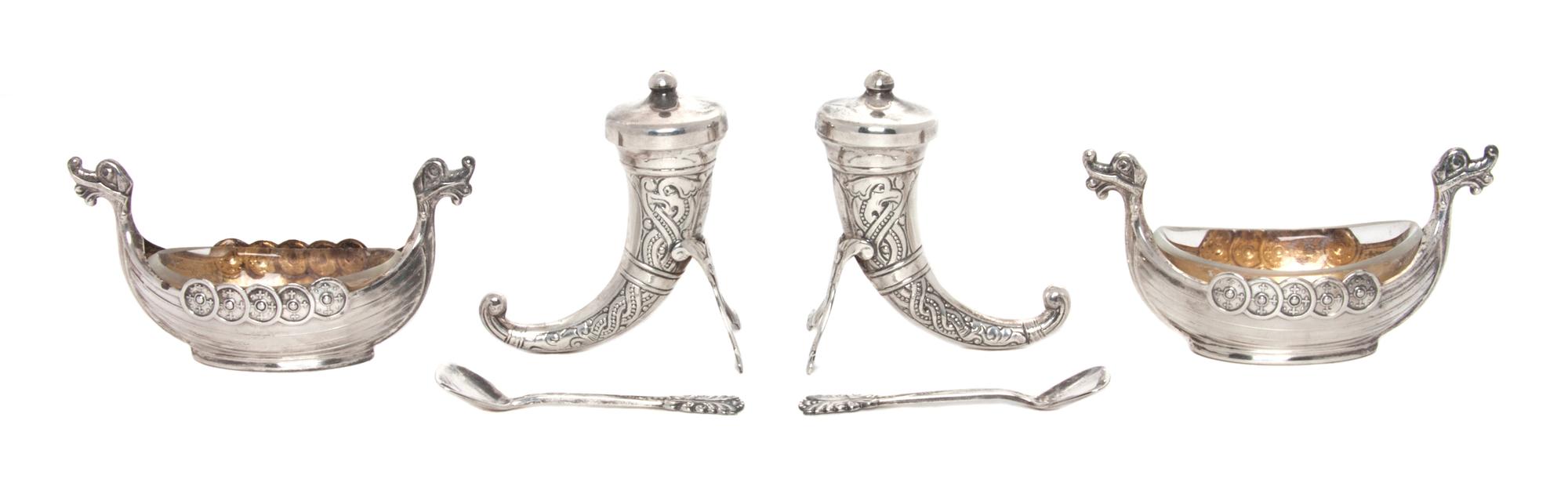 Two Norwegian Silver Salt Sets, Magnus Aaes for David Andersen, each set comprising a boat form salt cellar with a glass liner, a spoon