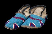 A Pair of Beaded Northern Plains Moccasins Length 10 1/2 inches.
