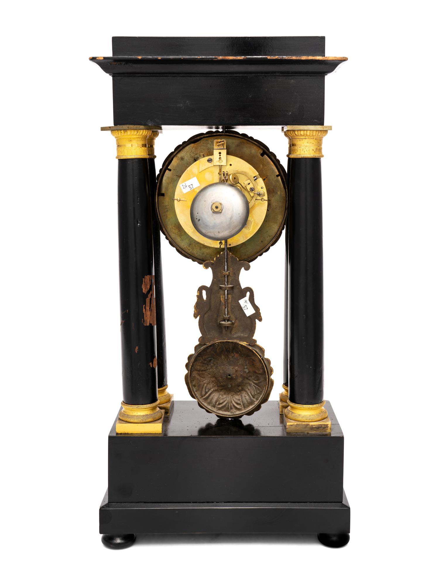 A Charles X Gilt Bronze Mounted Ebonized Fruitwood Clock