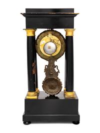 A Charles X Gilt Bronze Mounted Ebonized Fruitwood Clock