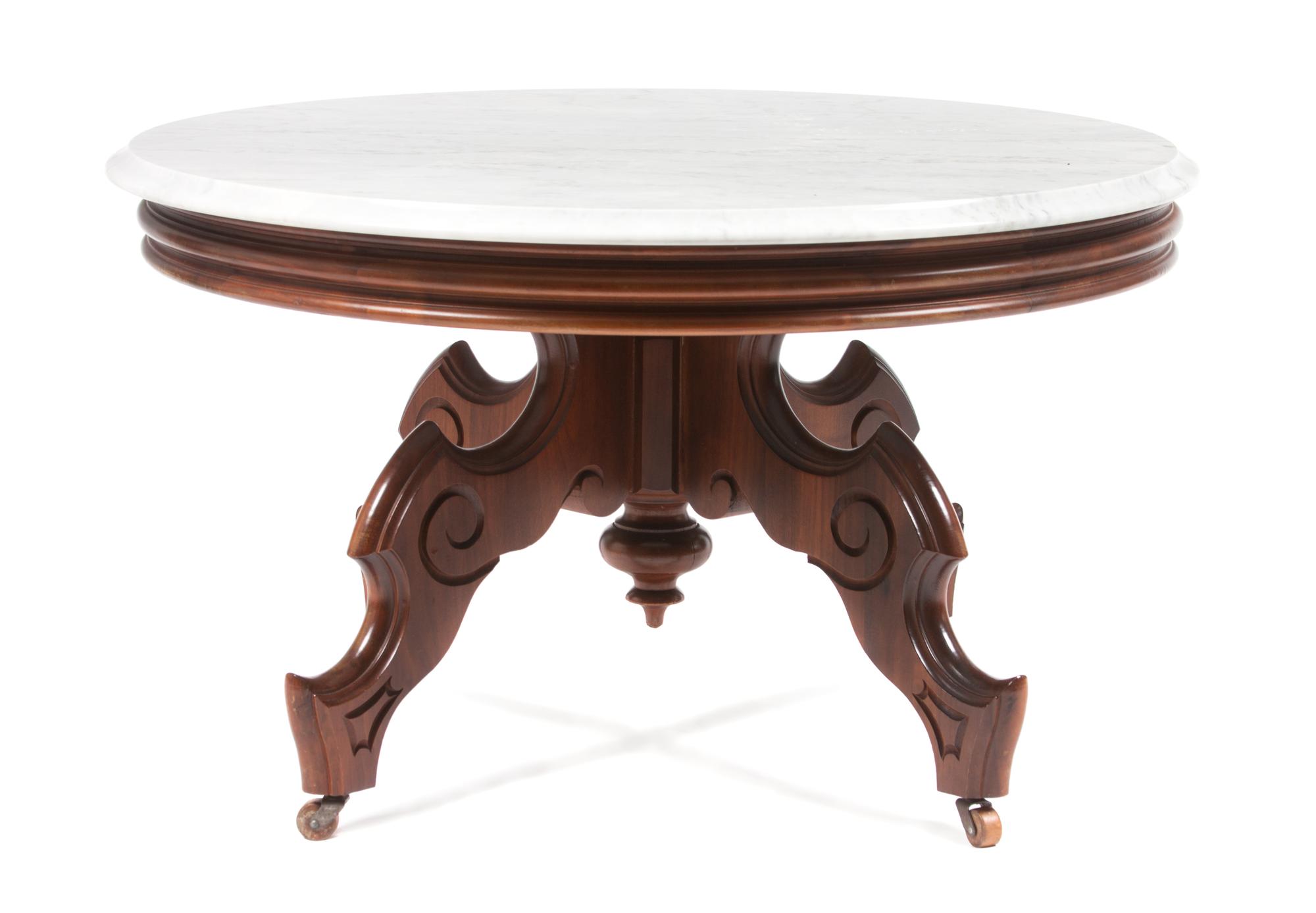 A Victorian Walnut Center Table Height 19 1/4 x diameter 33 inches. — 19TH CENTURY, WITH ALTERATION