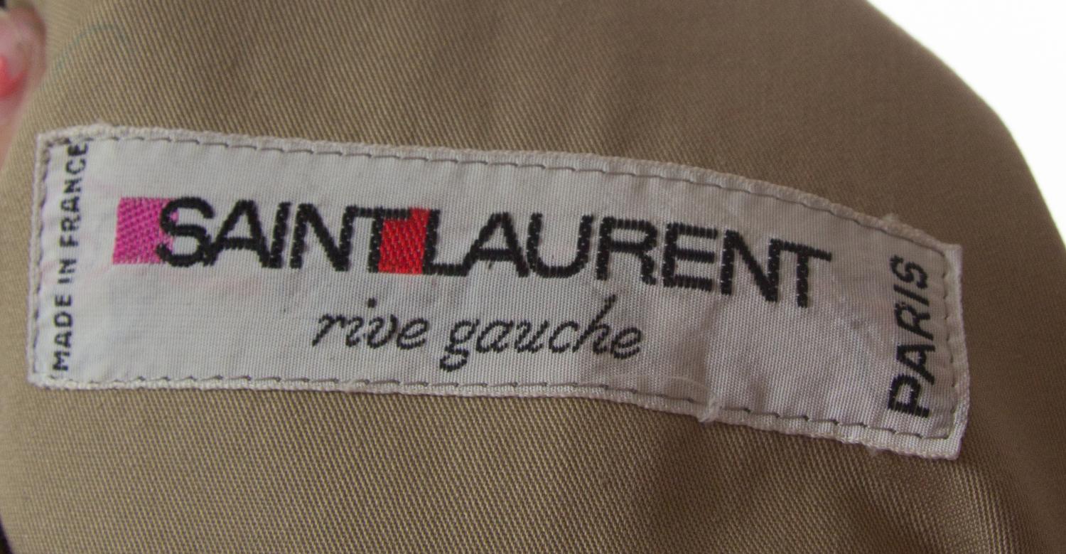 An Yves Saint Laurent Double Breasted Trench Coat,