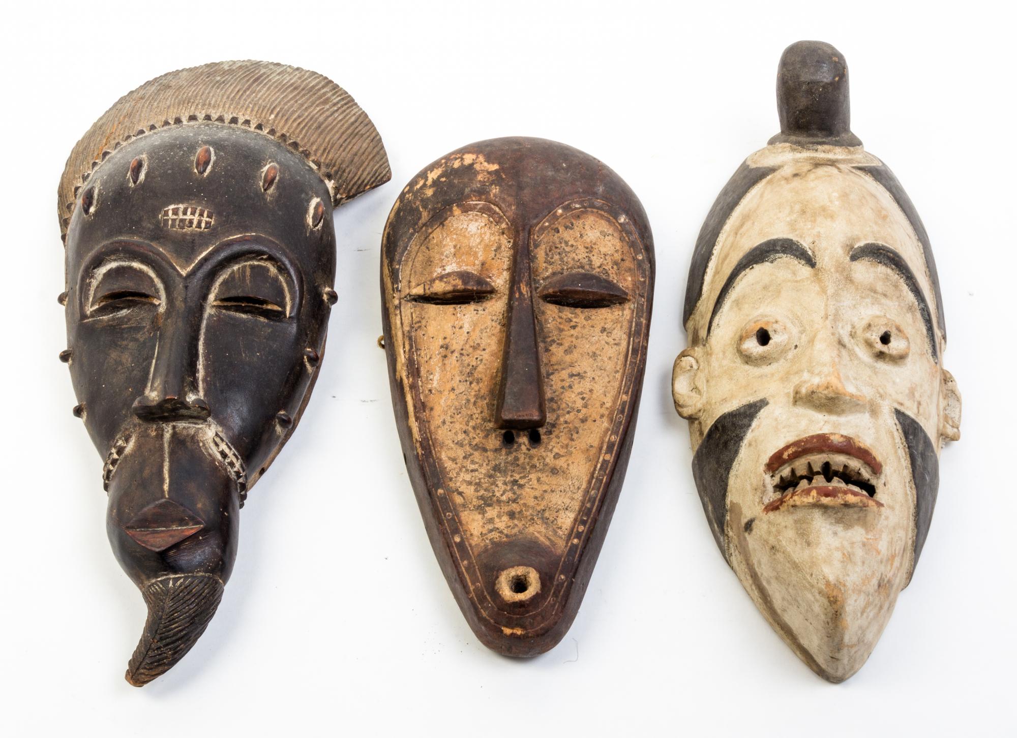 A Group of Three Masks Height of first 19 inches.