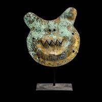 A Vicus Copper Gilt Feline Head Pendant