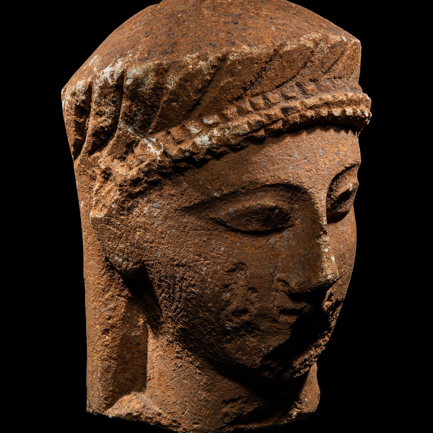 A Cypriot Limestone Votive Head