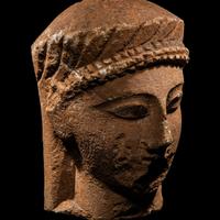 A Cypriot Limestone Votive Head