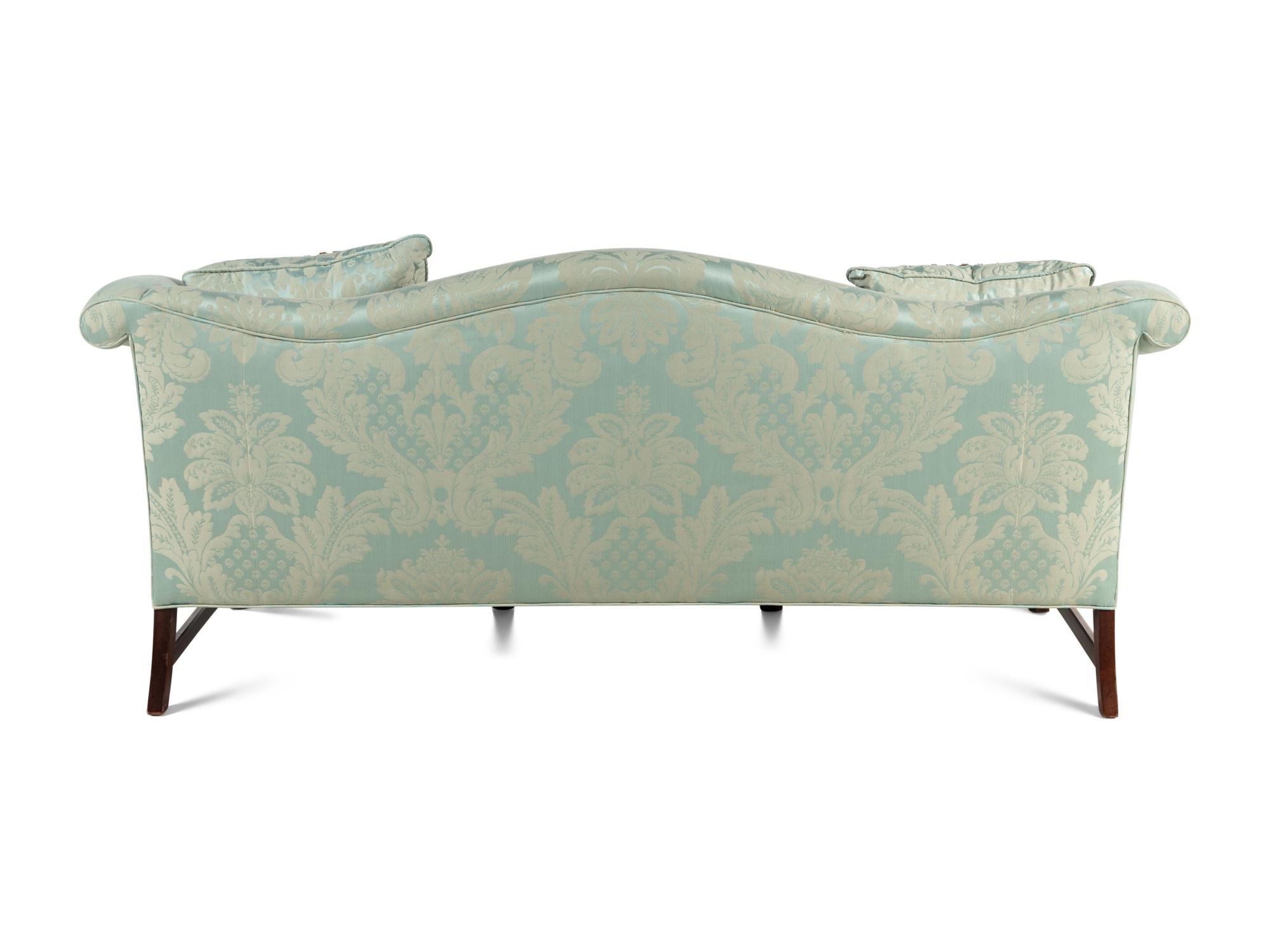 A Georgian Style Damask Upholstered Camelback Sofa