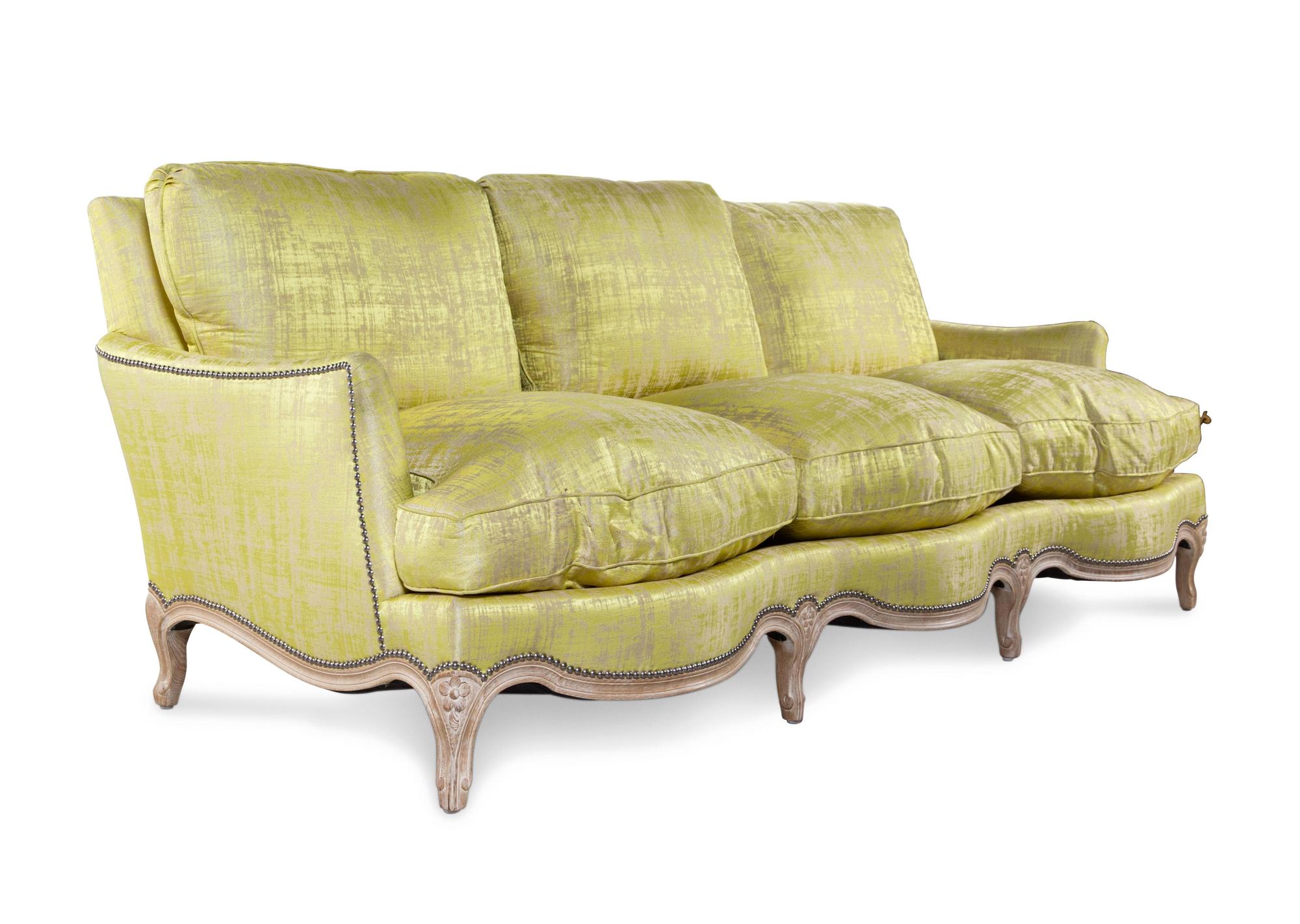 A Louis XV Style Cerused Silk Upholstered Sofa