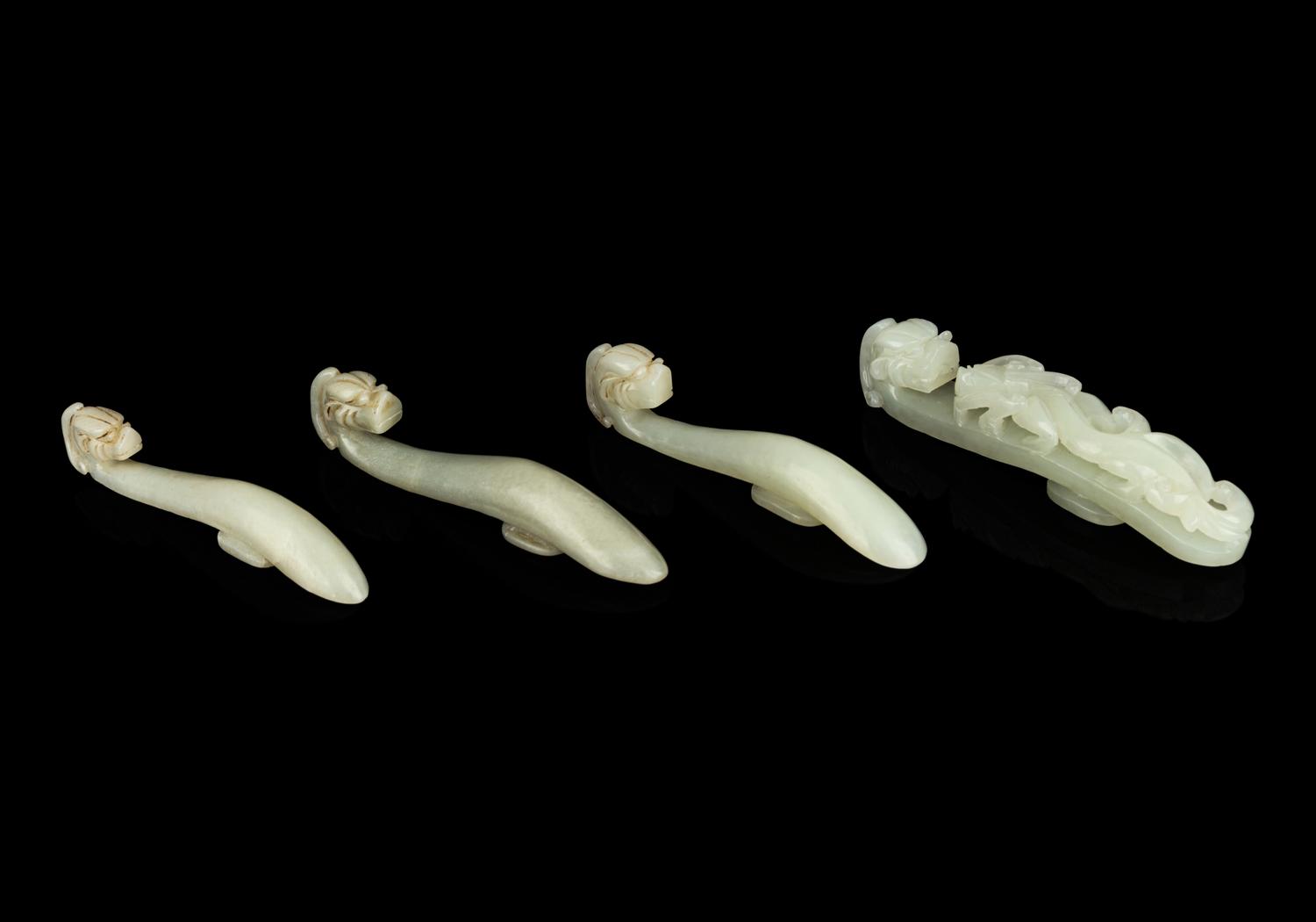 Four Chinese Celadon Jade 'Chilong' Belt Hooks