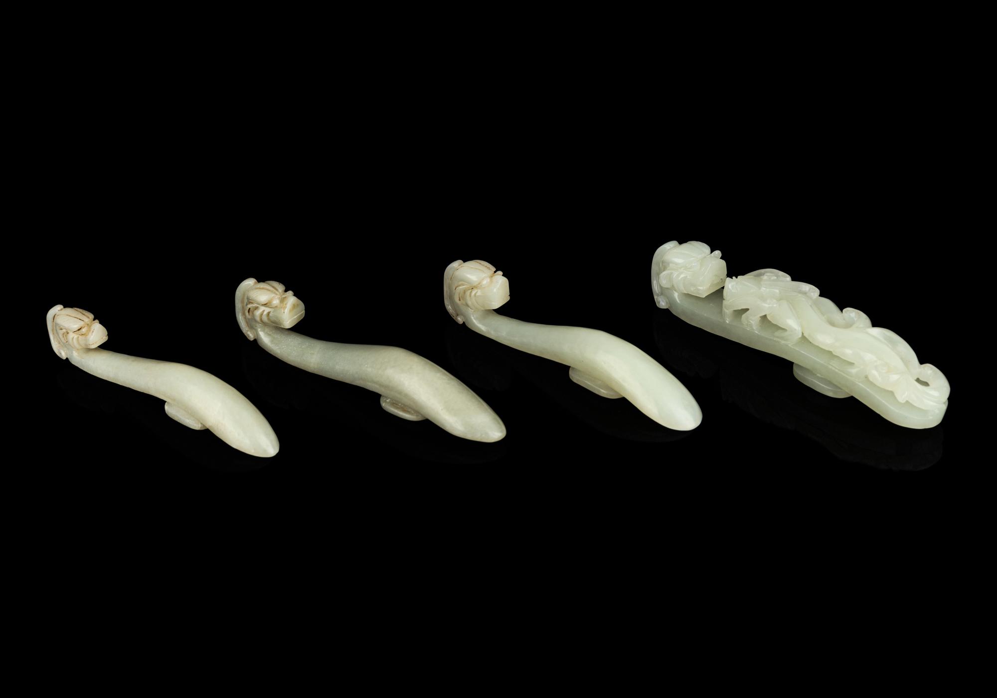Four Chinese Celadon Jade 'Chilong' Belt Hooks