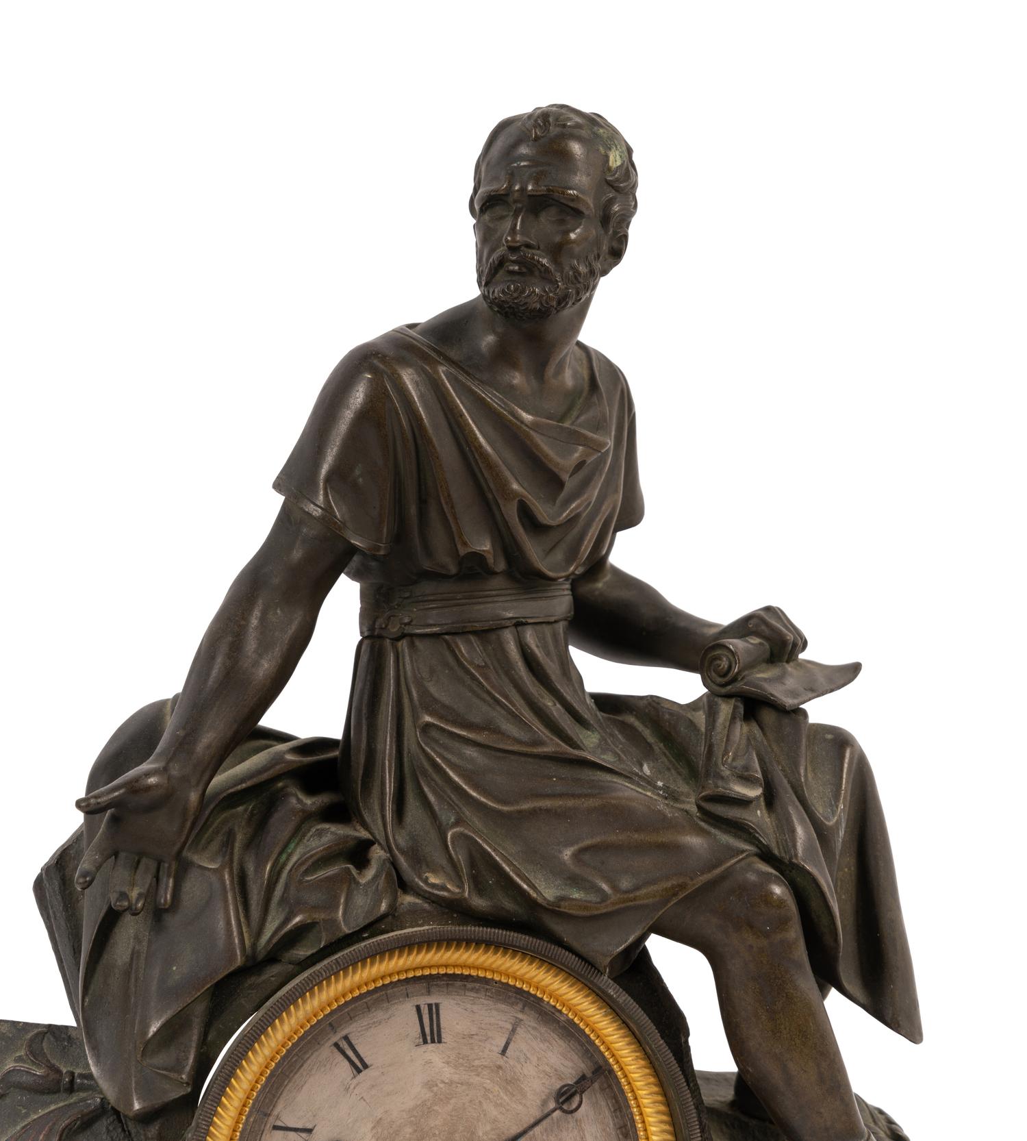 An Empire Style Patinated Bronze and Marble Figural Mantel Clock