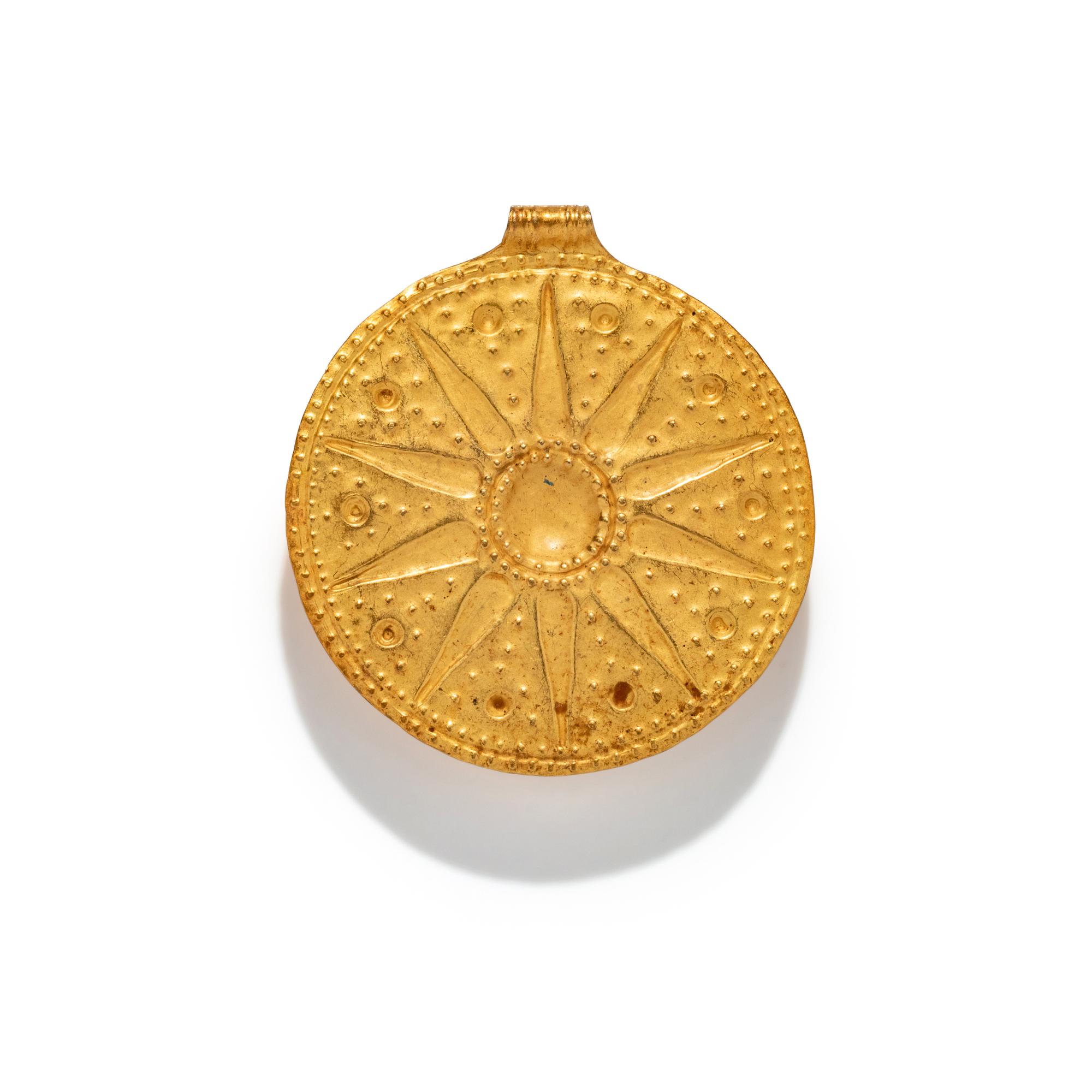 A Near Eastern Gold Disk Pendant