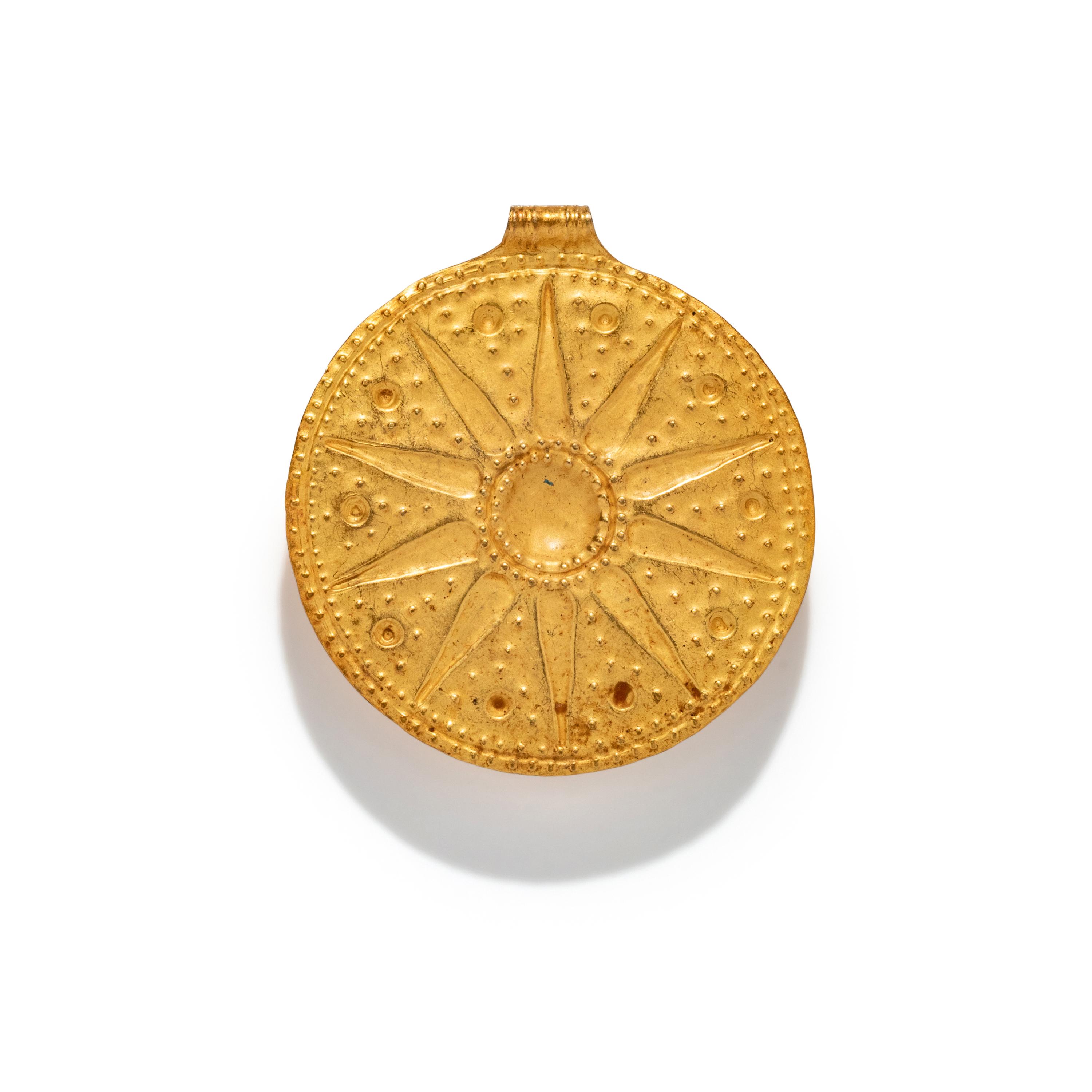 A Near Eastern Gold Disk Pendant