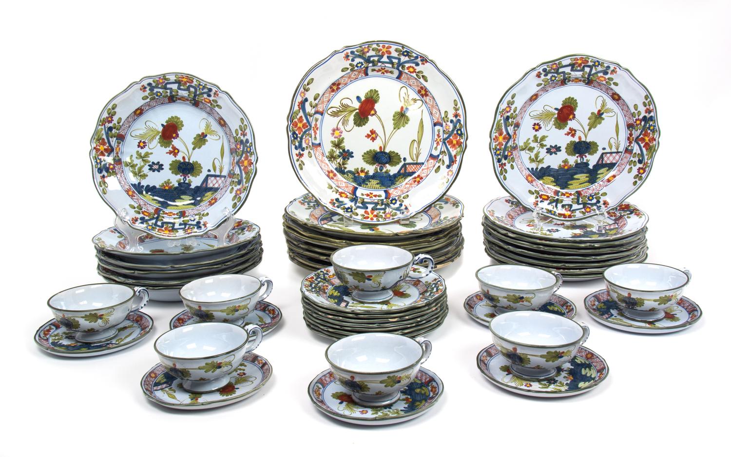 An Italian Ceramic Partial Dinner Service Diameter of largest 11 inches. — 20TH CENTURY