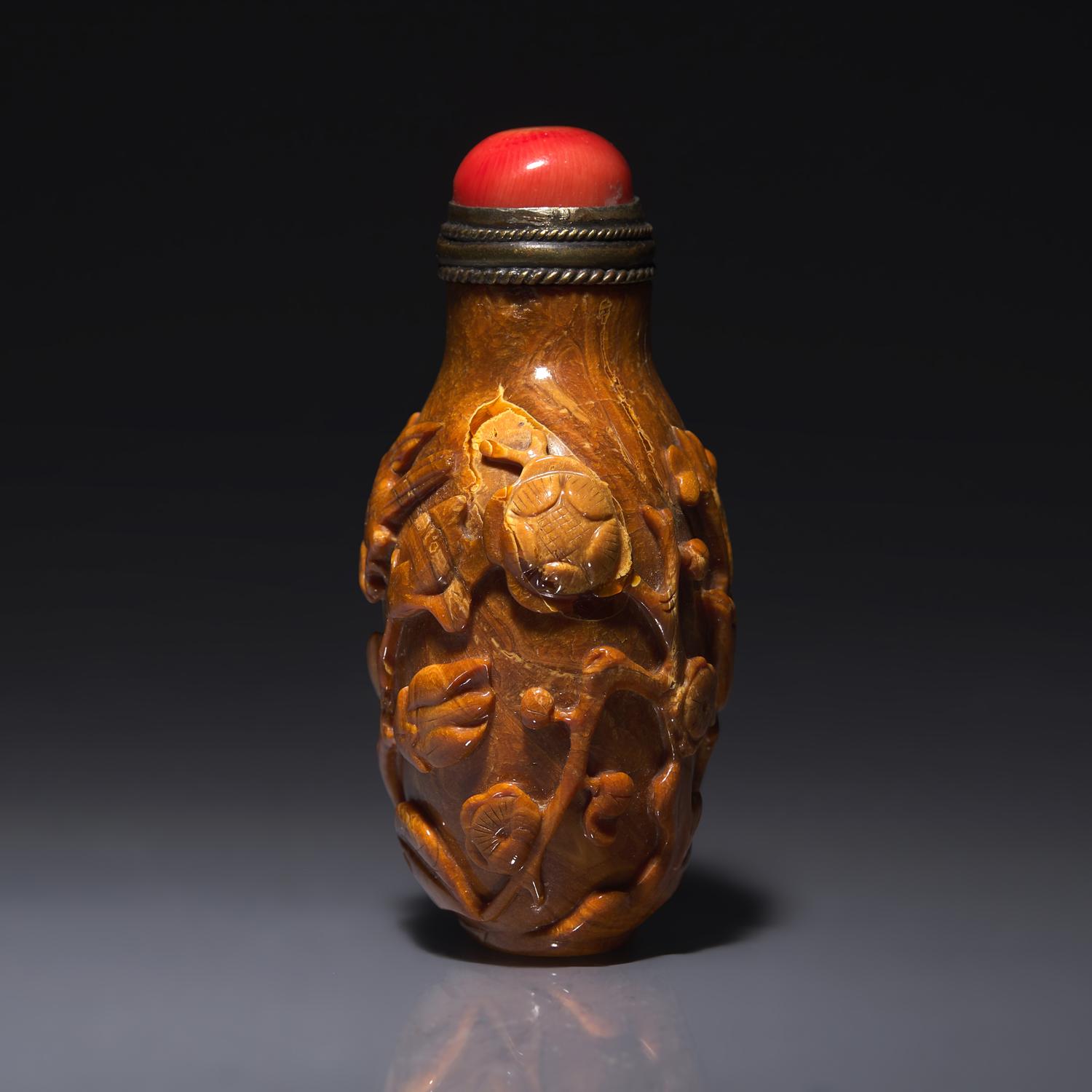 A Chinese Bird and Flower-Carved Root Amber Snuff Bottle 琥珀雕花鳥鼻烟壺