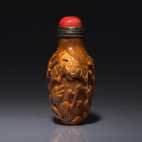 A Chinese Bird and Flower-Carved Root Amber Snuff Bottle 琥珀雕花鳥鼻烟壺