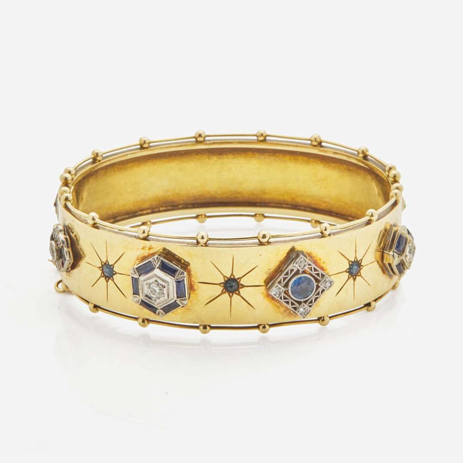 An Antique Yellow Gold Bangle Bracelet with Applique Charms