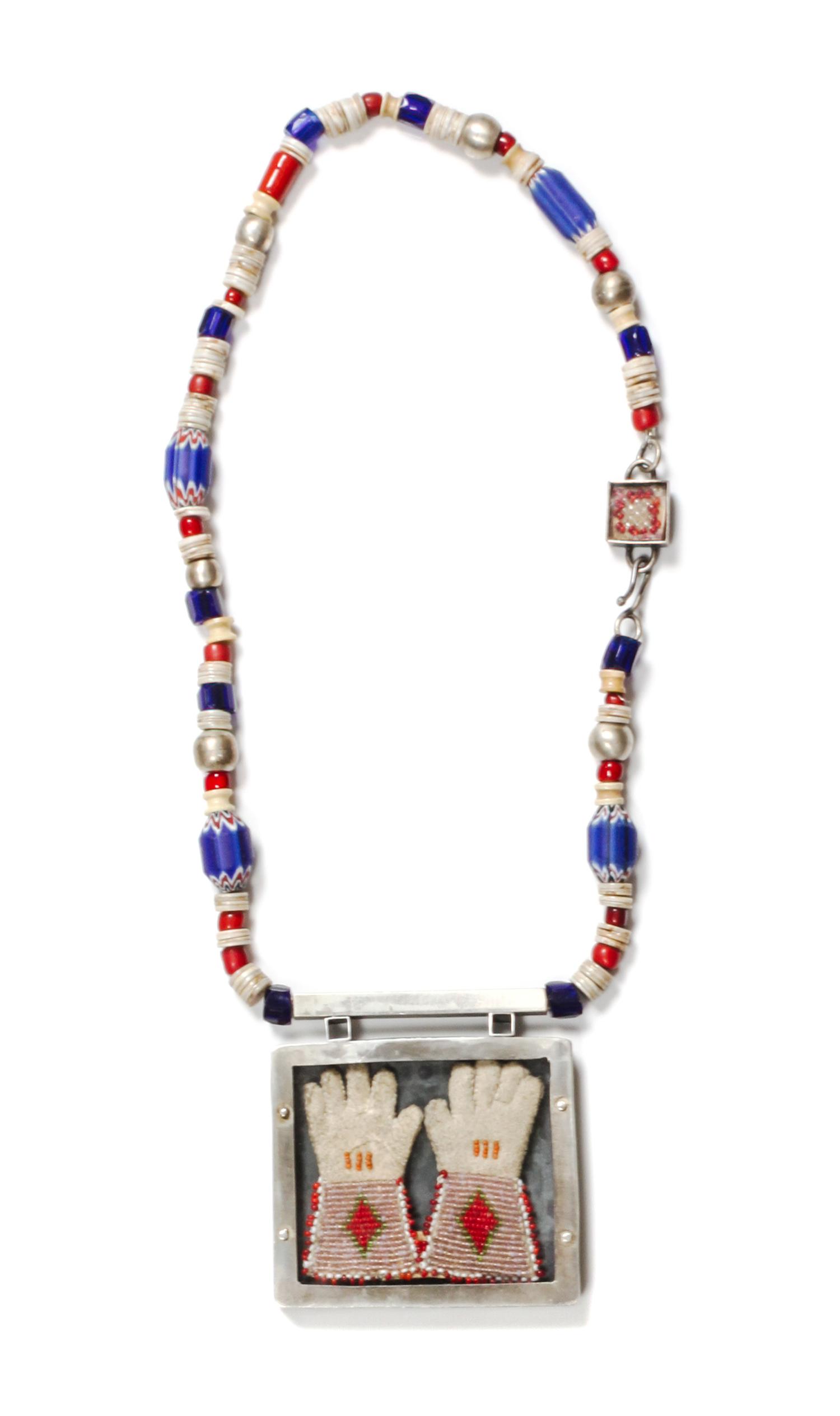 A Trade Bead Presentation Box Necklace Length 20 inches; pendant 3 1/2 x 3 1/2 inches.