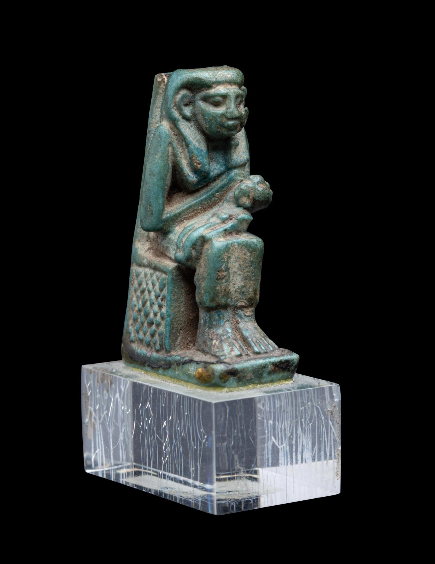 An Egyptian Faience Isis Nursing Horus