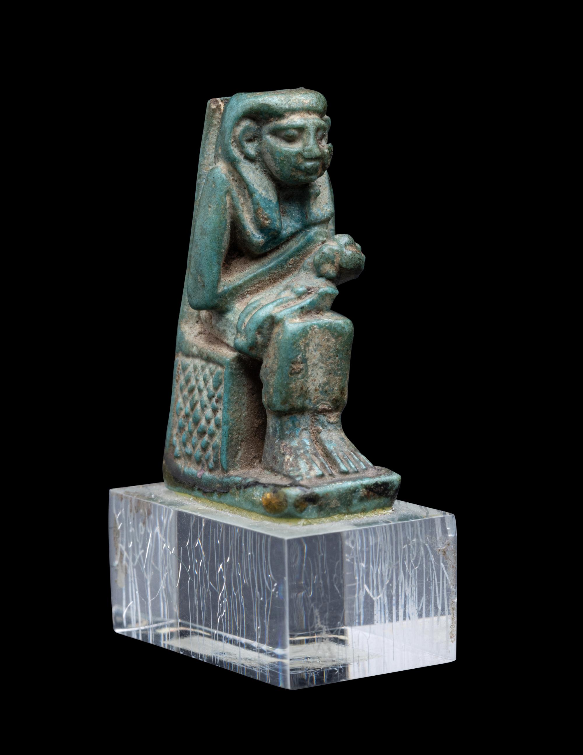 An Egyptian Faience Isis Nursing Horus
