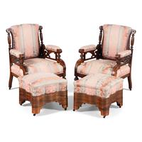 A Pair of Victorian Walnut Armchairs with Associated Foot Stools