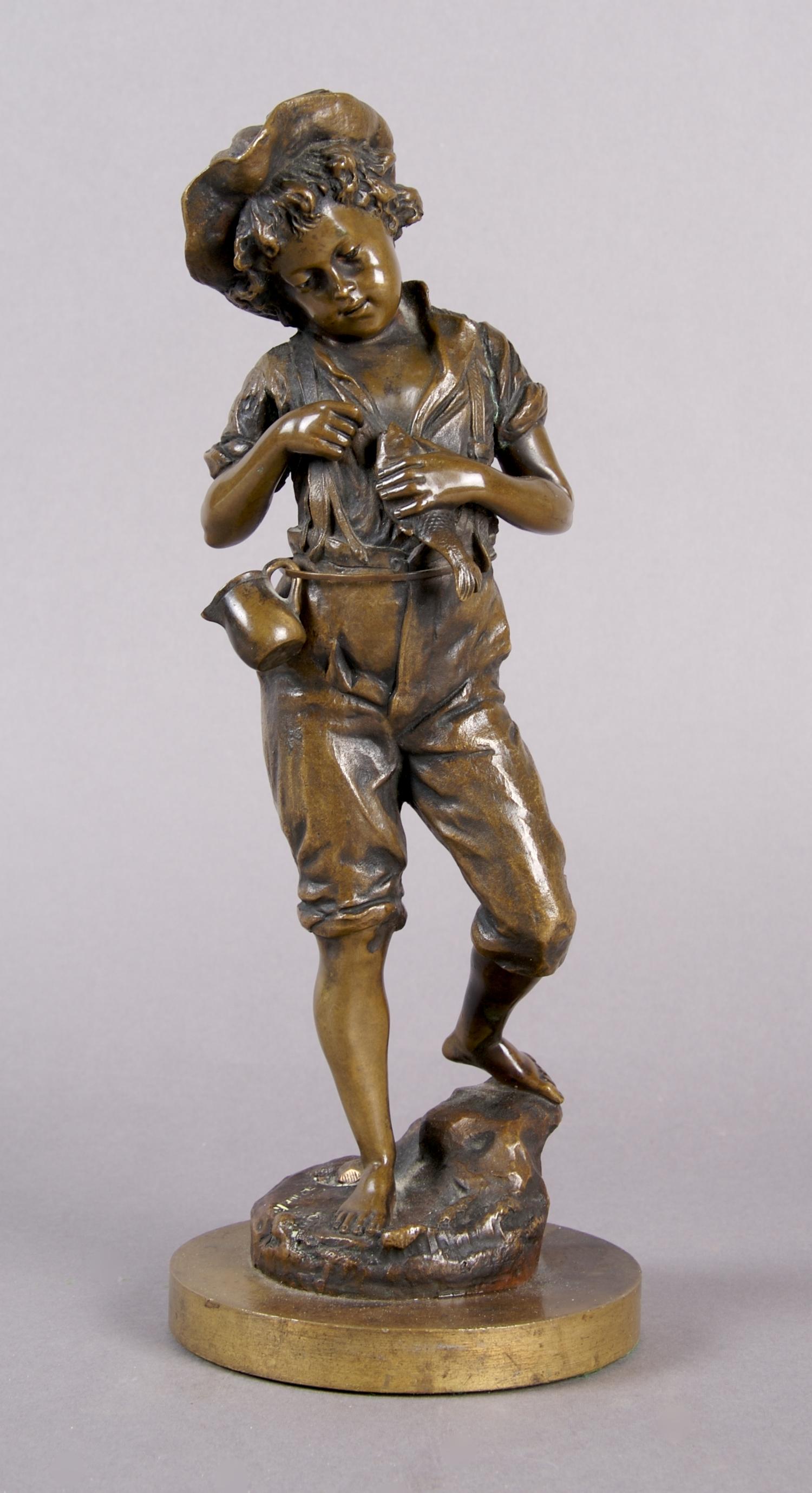A Continental Bronze Figure of a Boy, Height 10 1/4 inches.