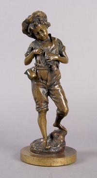 A Continental Bronze Figure of a Boy, Height 10 1/4 inches.