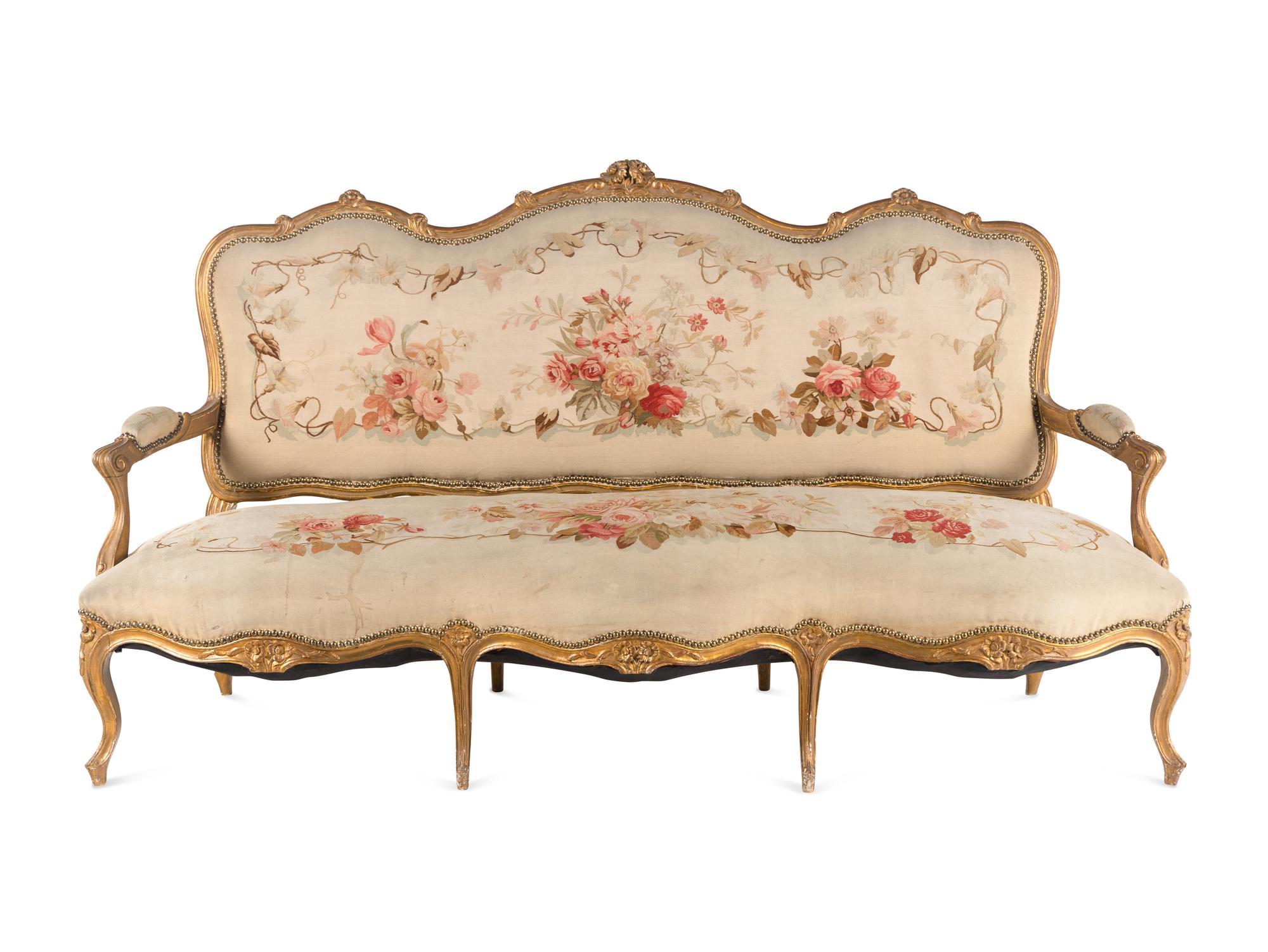 A Louis XV Style Giltwood Seven-Piece Salon Suite