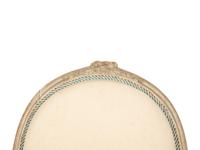 A Set of Four Louis XVI Grey-Painted and Parcel Gilt Fauteuils
