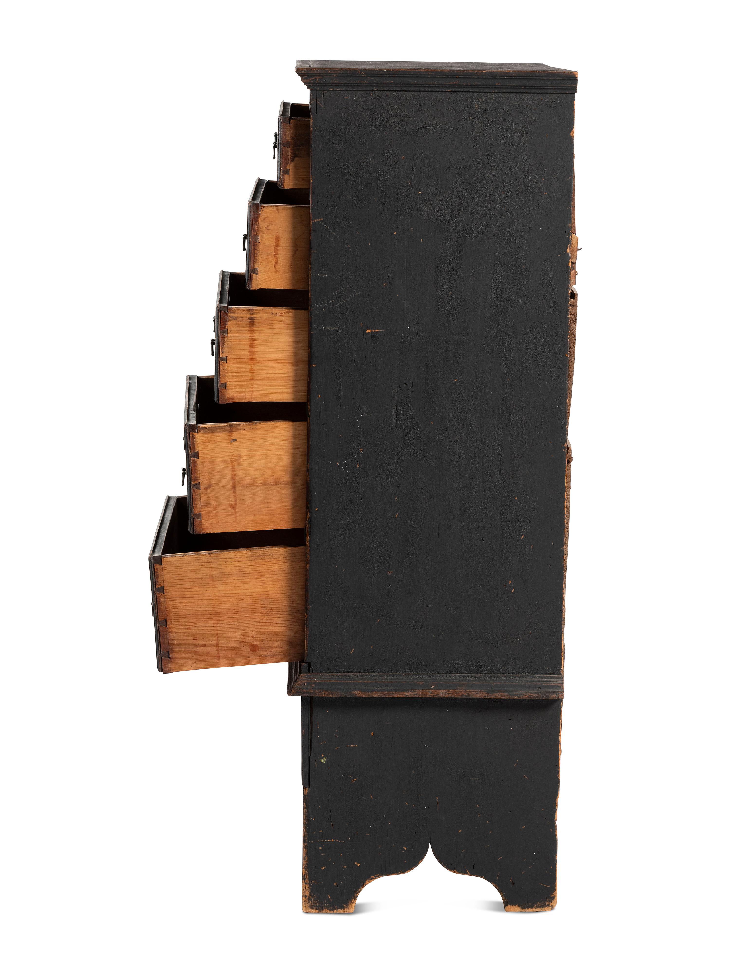 A Country Queen Anne Black Painted Cherrywood and Pine Tall Chest of Drawers, 18th Century