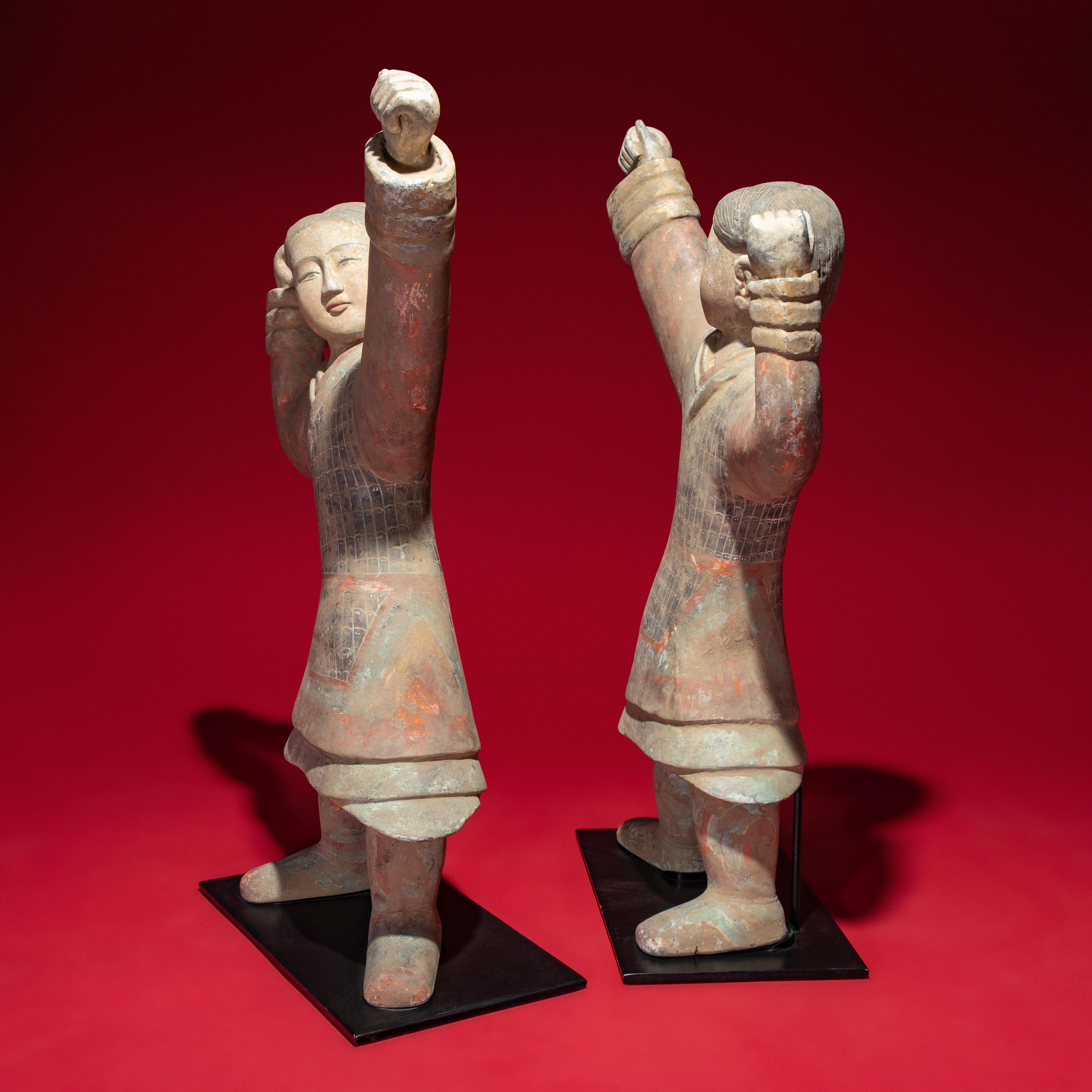 A Large Pair of Chinese Painted Pottery Archers, Western Han Dynasty — 西漢 彩繪射姿立俑一對