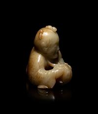 A Chinese Russet and Pale Celadon Jade Figure of a Boy