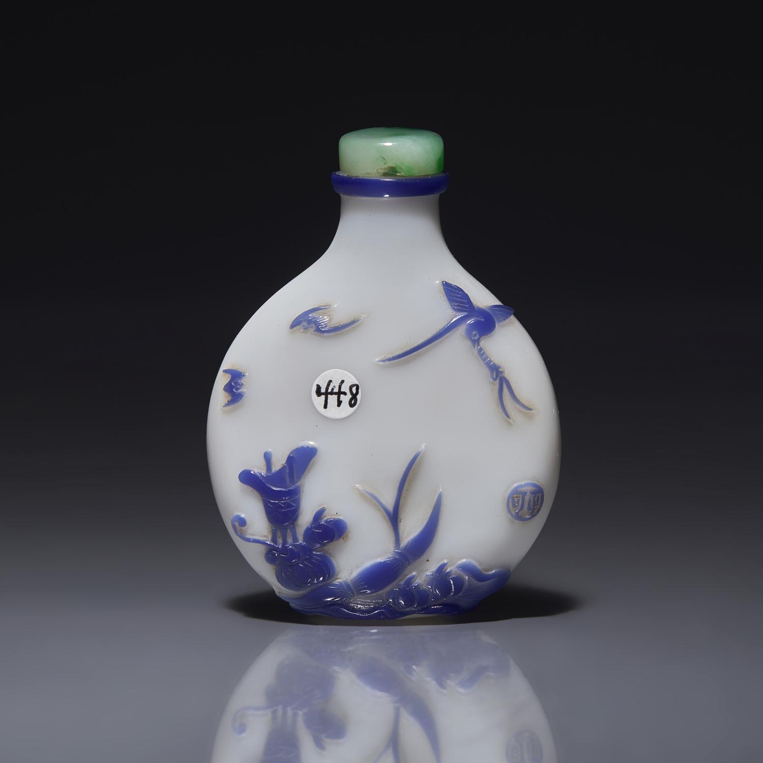 A Chinese Yangzhou Type Blue-Overlay Glass Snuff Bottle, Late 19th -20th Century 晚清-民國 涅白地套寶石藍料山石博古圖鼻烟壺