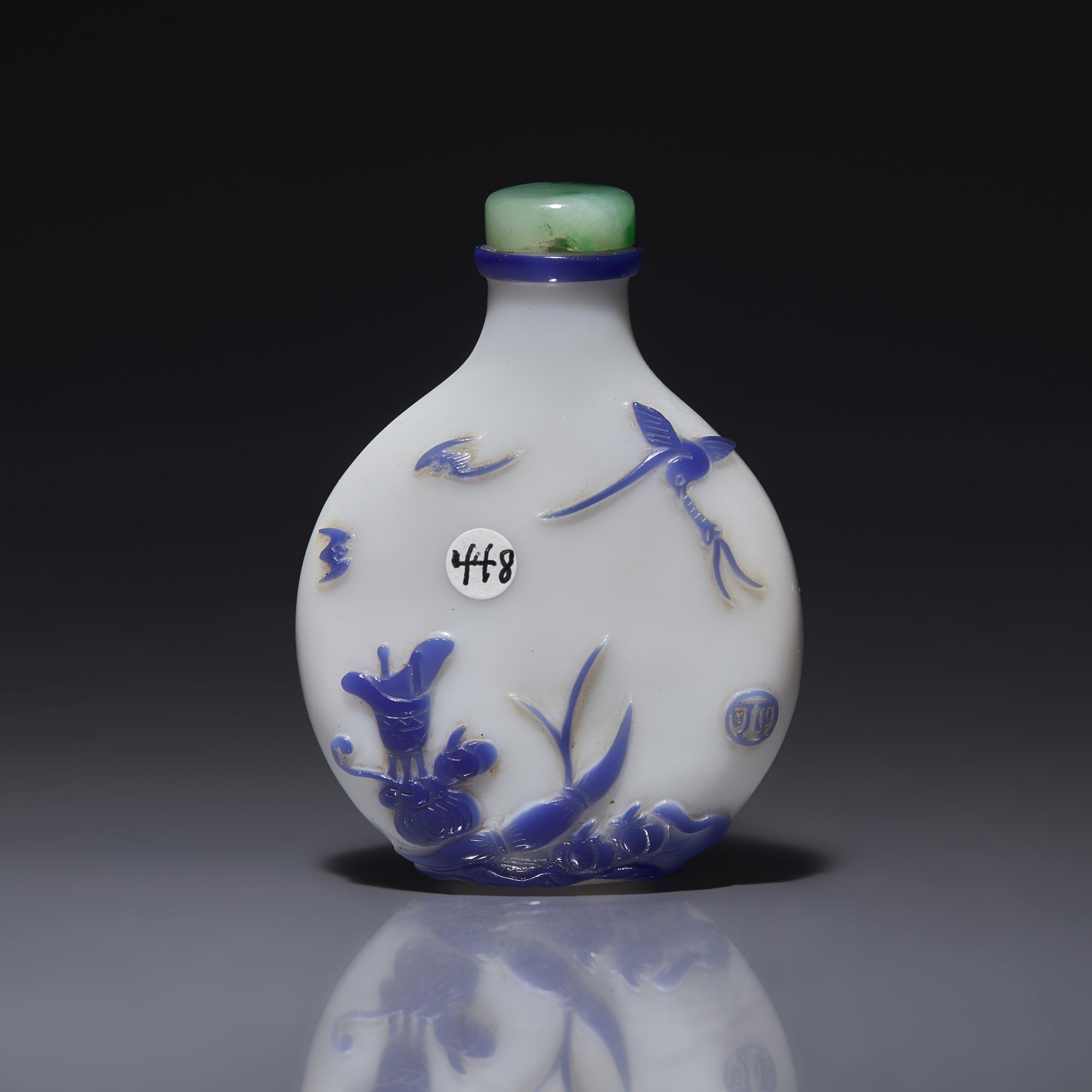 A Chinese Yangzhou Type Blue-Overlay Glass Snuff Bottle, Late 19th -20th Century 晚清-民國 涅白地套寶石藍料山石博古圖鼻烟壺