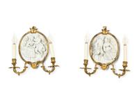 A Pair of Continental Plaster Relief Medallion and Gilt Bronze Two-Light Sconces
