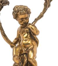 A Pair of French Gilt Bronze and Marble Figural Two-Light Candelabra