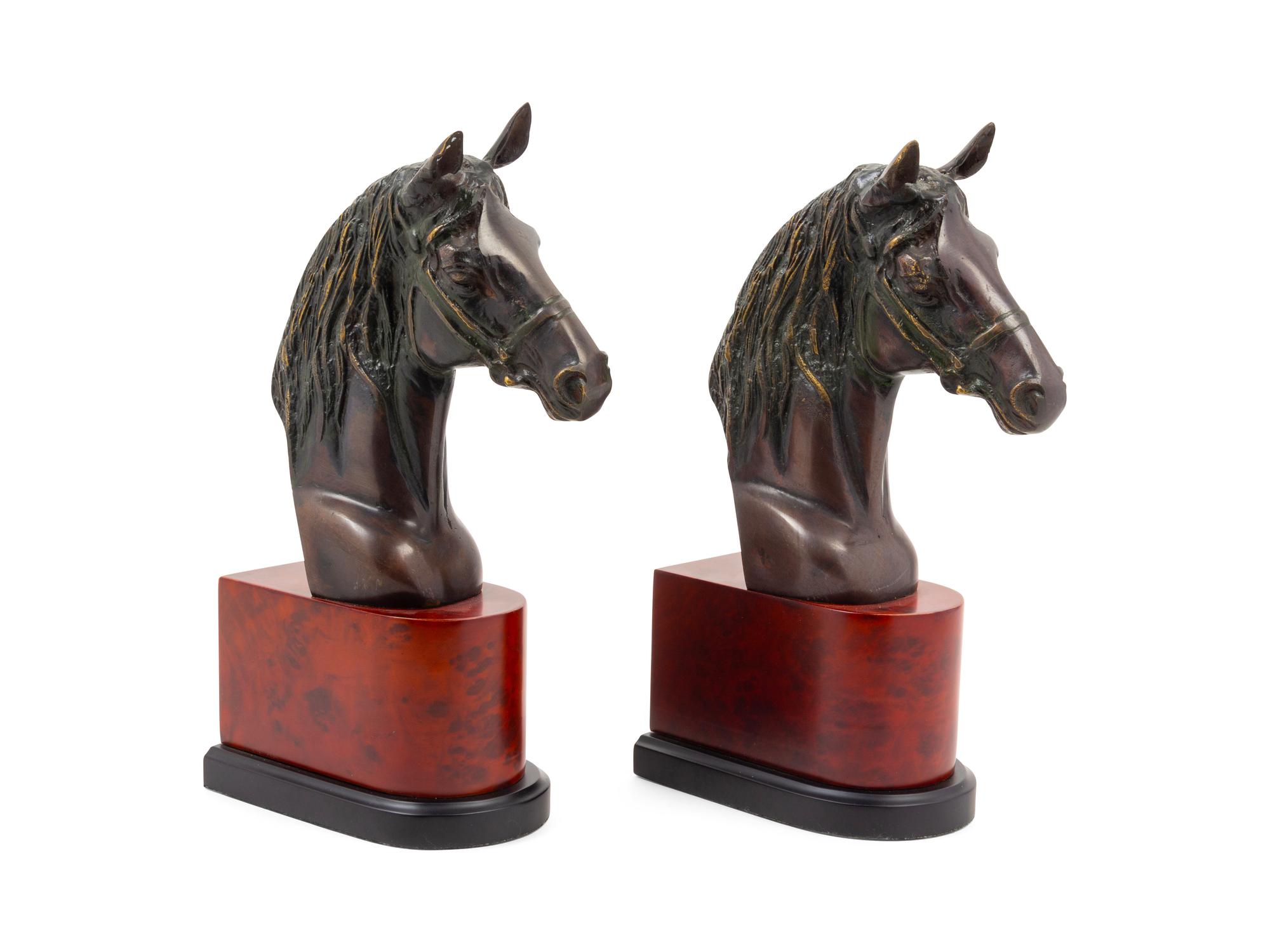 A Pair of Cast Metal Busts of Horses