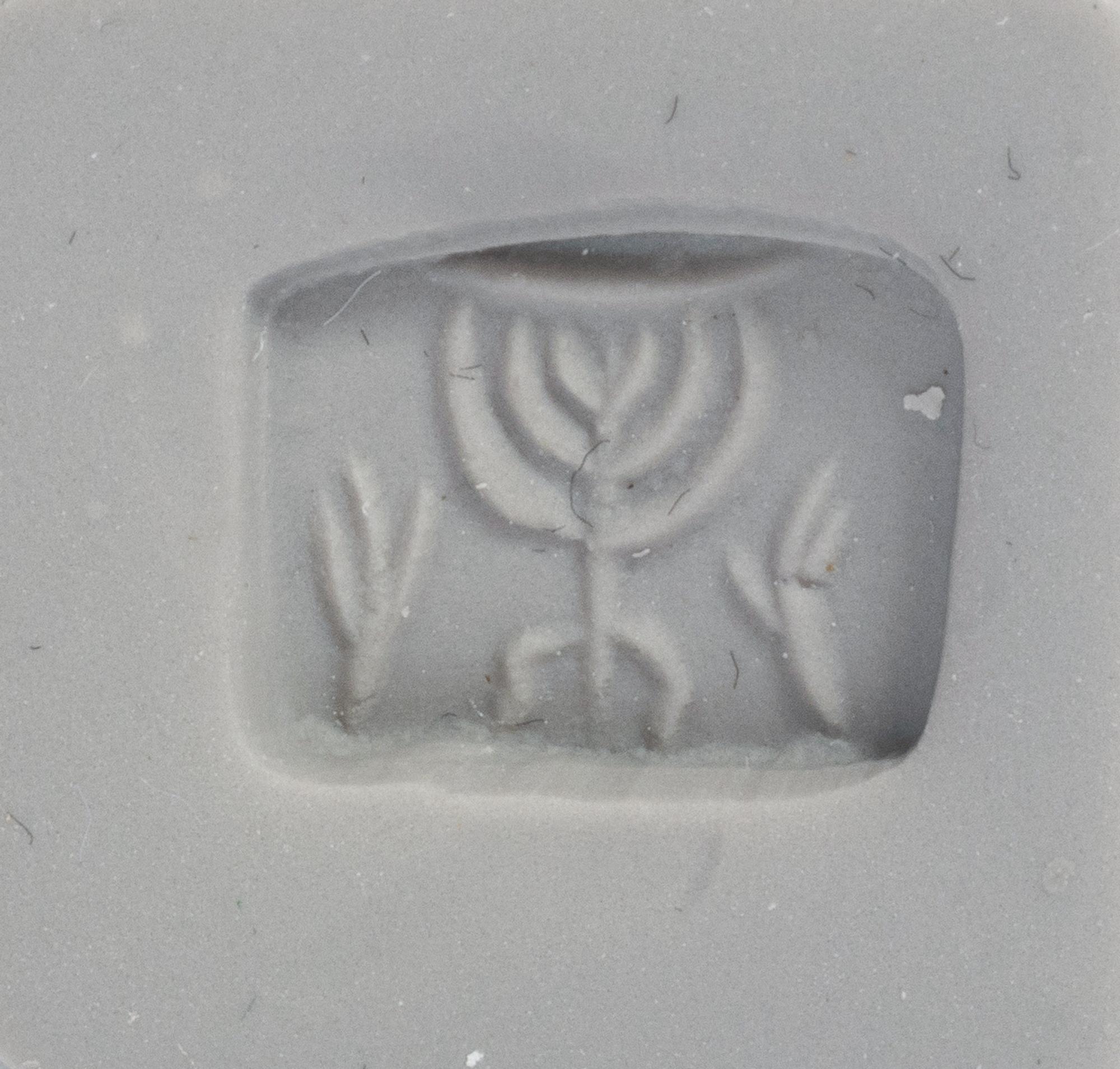 A Holy Land Bronze Ring with a Menorah