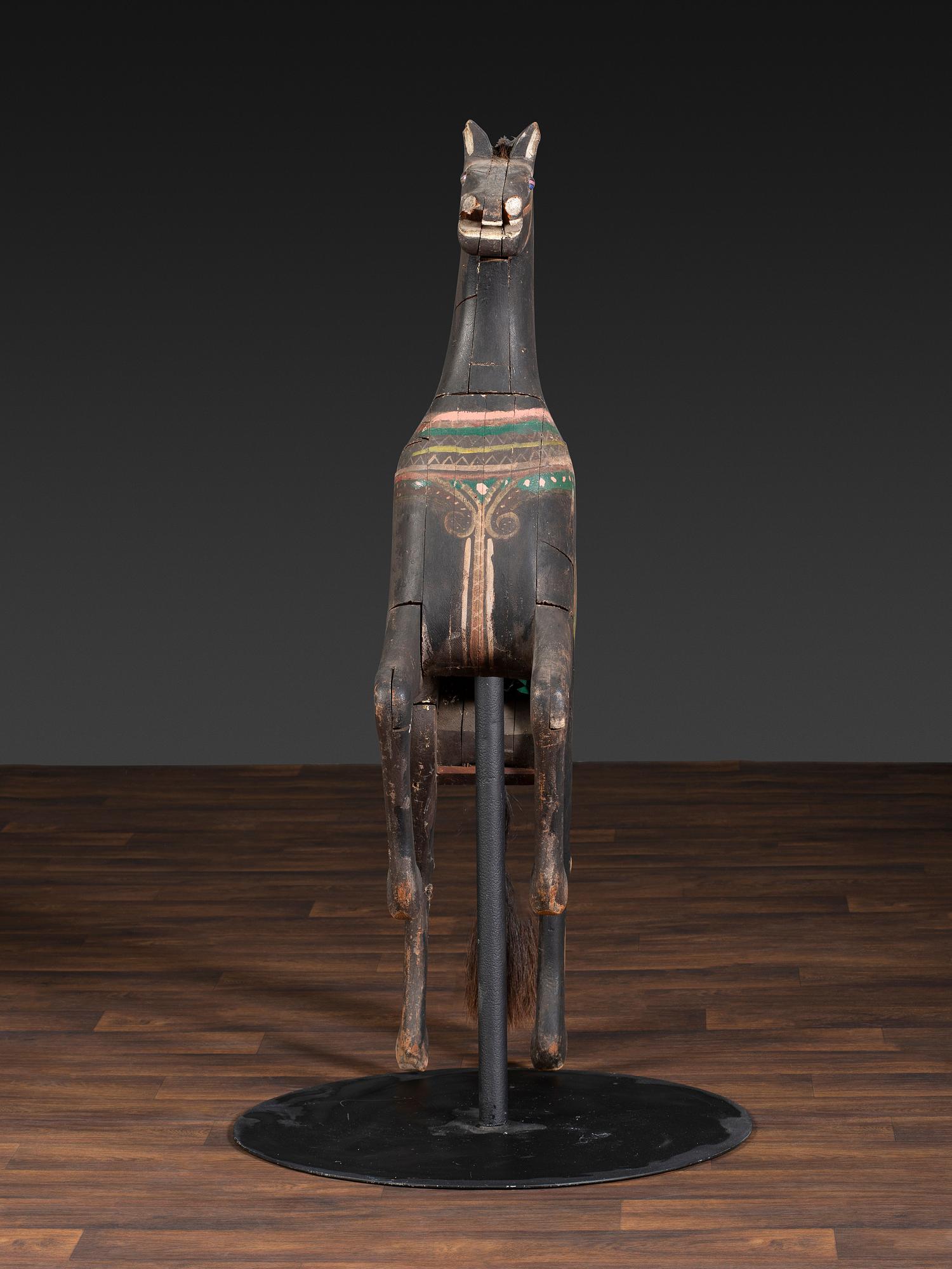 An American Glass Inset, Carved and Painted Pine Carousel Horse