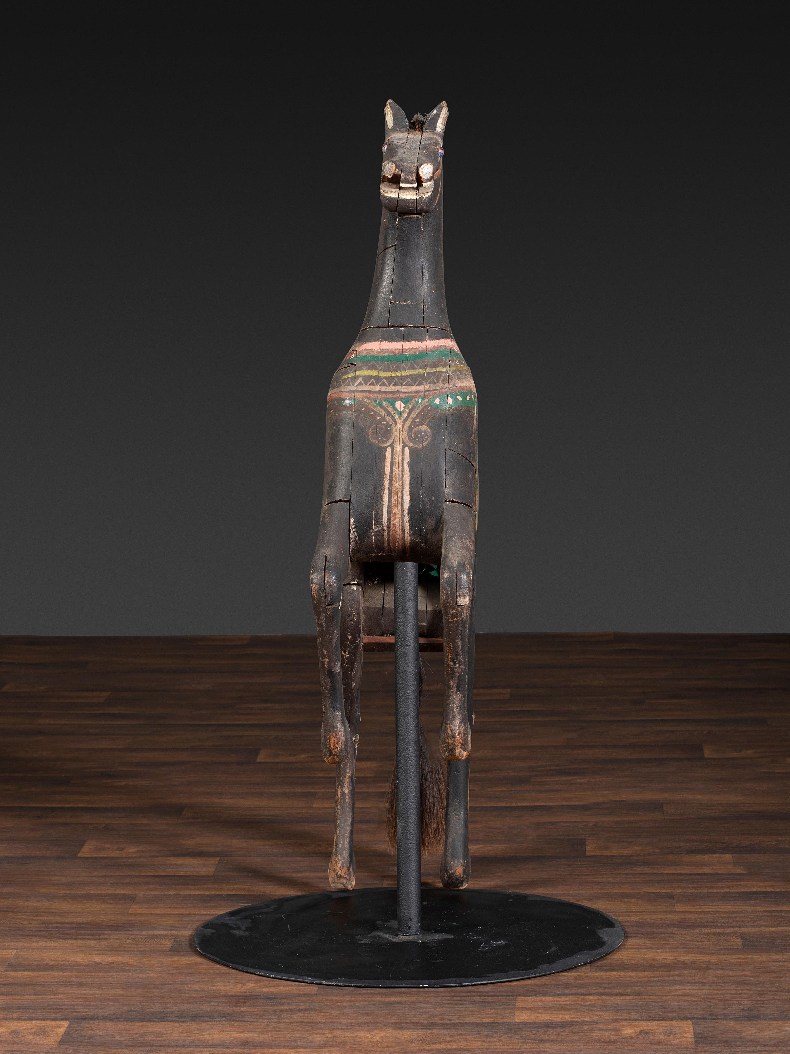 An American Glass Inset, Carved and Painted Pine Carousel Horse