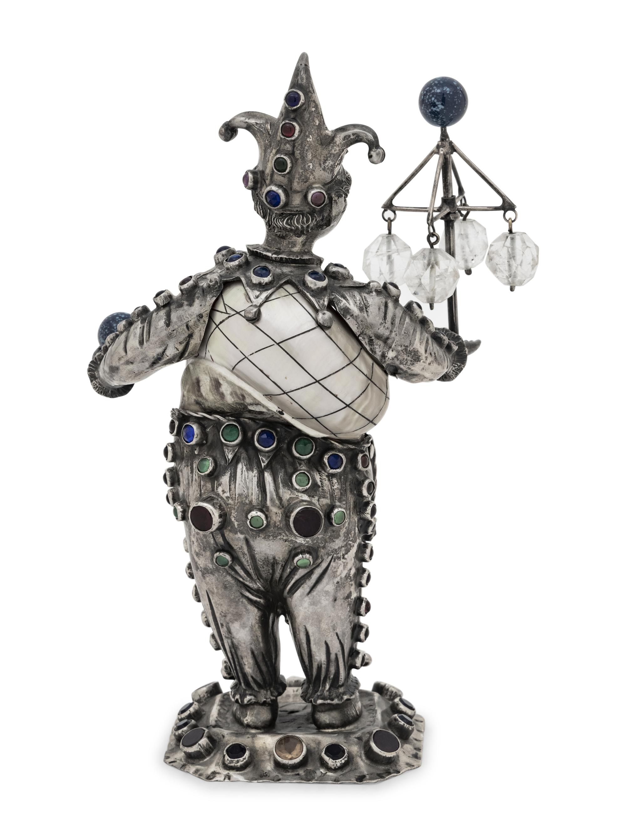 A German Silver and Jewel-Mounted Shell Figure of a Jester