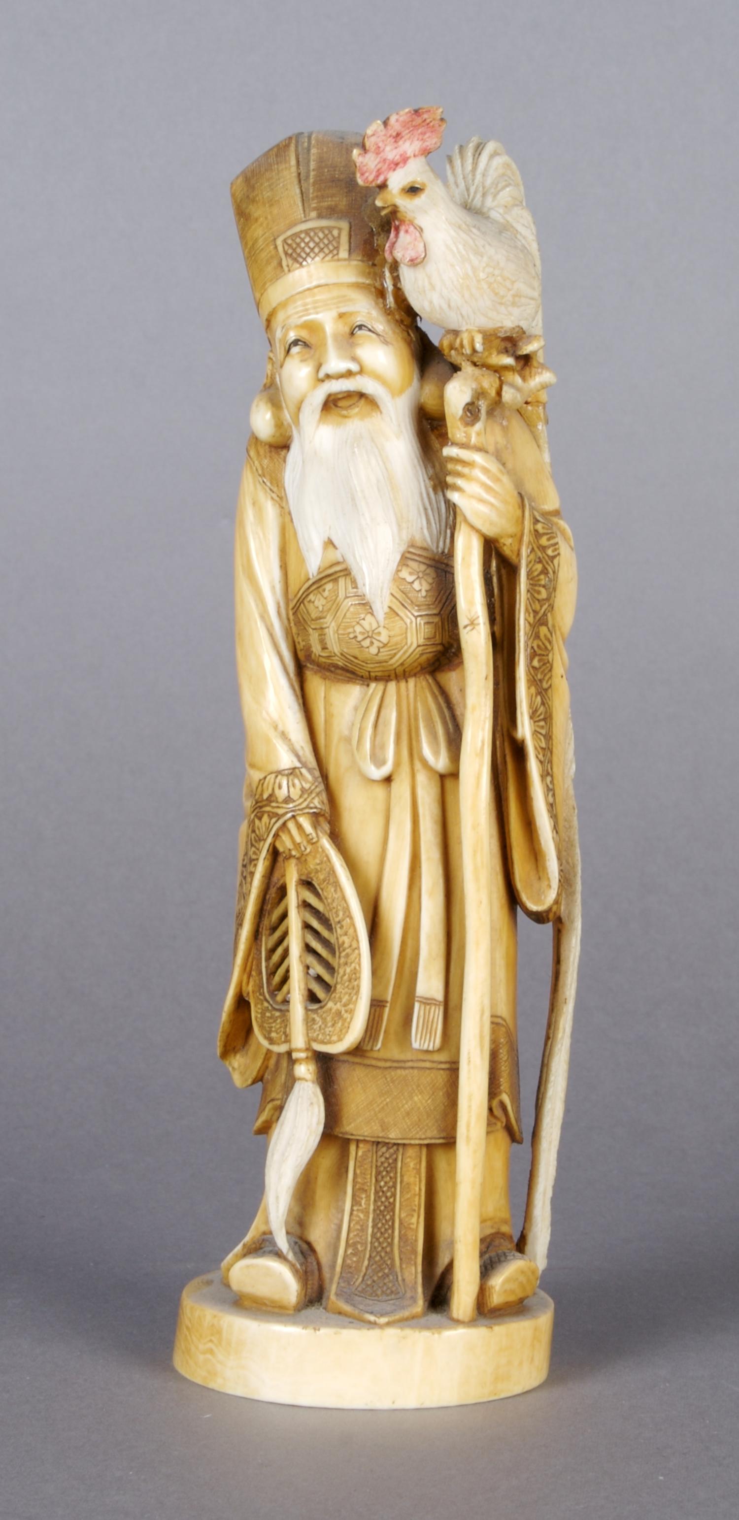 jA Japanese Carved Ivory Figure, Height 7 3/8 inches.