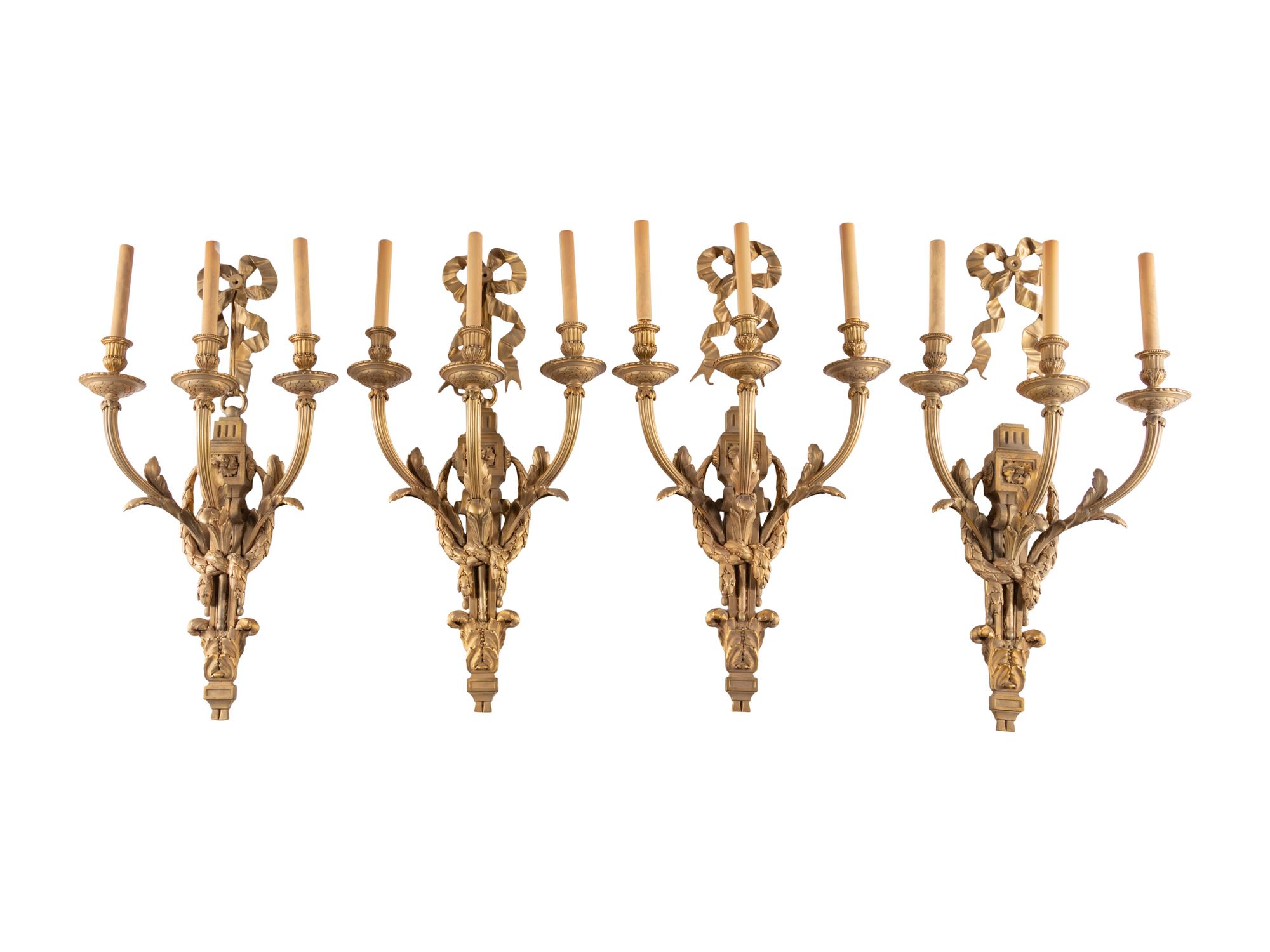 A Set of Eight Louis XVI Style Gilt Bronze Three-Light Sconces