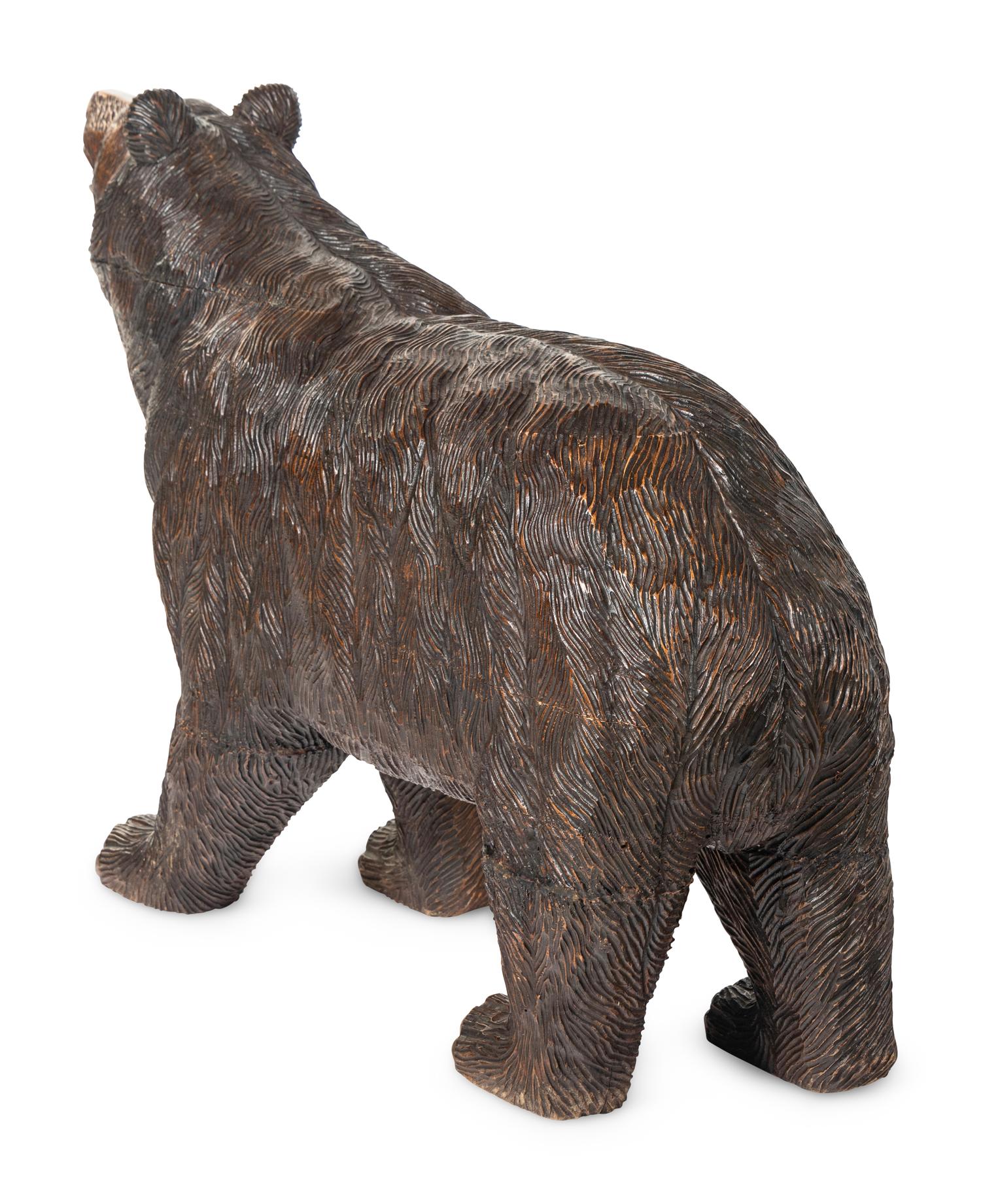 A Swiss Black Forest Carved Walnut Bear