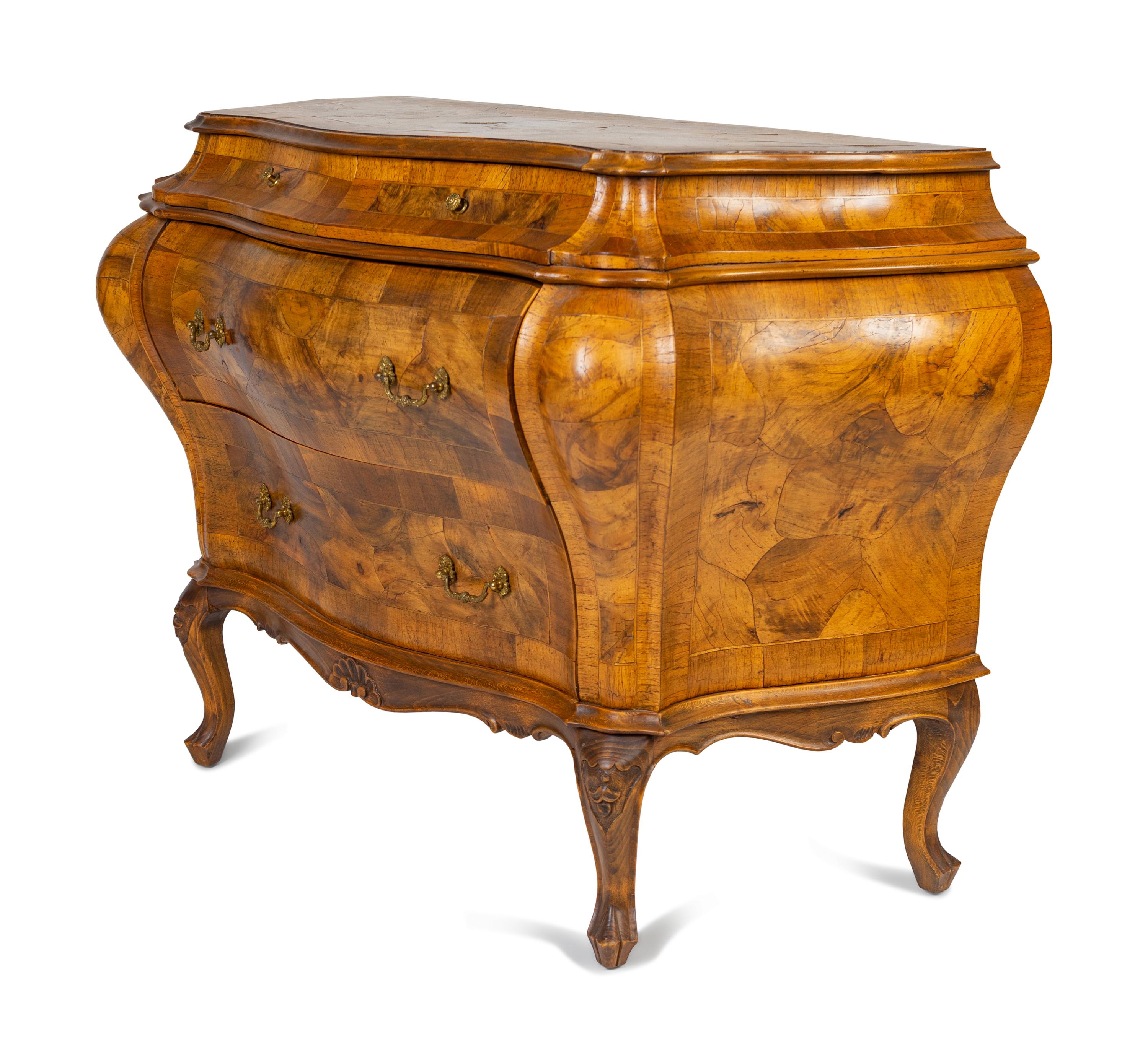 An Italian Rococo Style Olivewood Bombe Commode